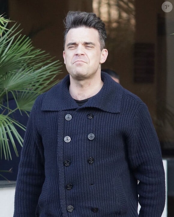 Robbie Williams quitte les studios ITV à Londres, le 27 février 2013.