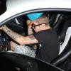 Justin Bieber au volant de sa Ferrari, accompagné de son ami Lil Twist, quitte le club Laugh Factory à Los Angeles, le 17 juin 2013. Il a heurté un photographe mais a été blanchi par la police.