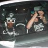 Le jeune Justin Bieber au volant de sa Ferrari, accompagné de son ami Lil Twist, quitte le club Laugh Factory à Los Angeles, le 17 juin 2013. Il a heurté un photographe mais a été blanchi par la police.