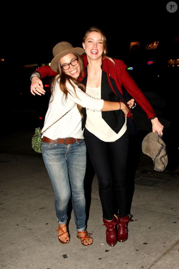 Amber Heard avec une amie en sortant du Largo à Los Angeles le 18 juin 2013