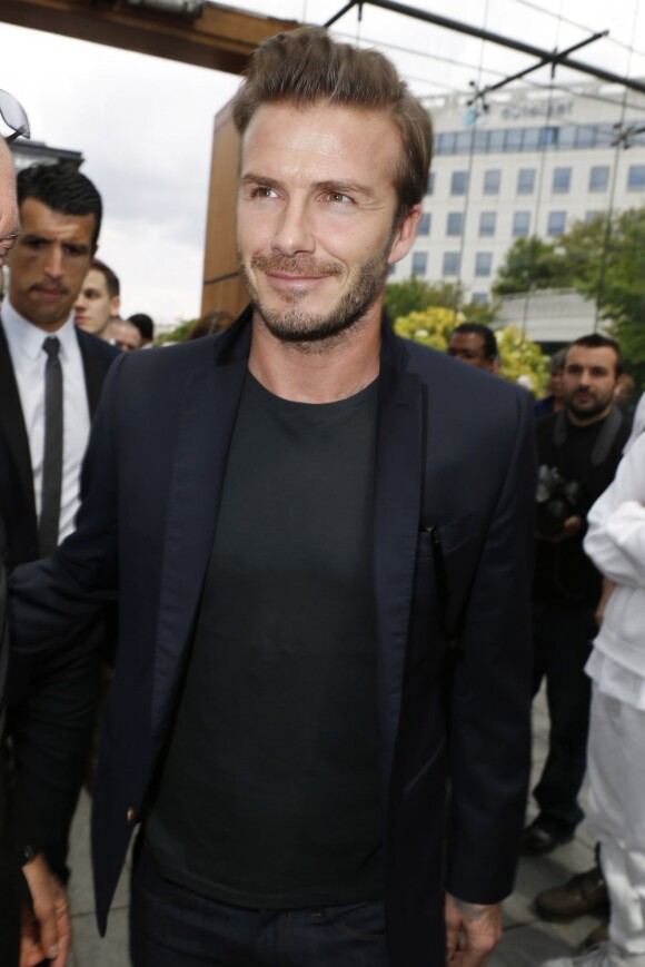 David Beckham arrive au parc André Citroën pour assister au défilé homme Louis Vuitton. Paris, le 27 juin 2013.