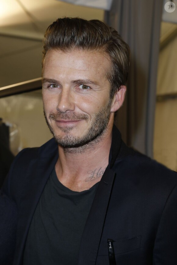 David Beckham dans les coulisses du défilé homme de Louis Vuitton au parc André Citroën. Paris, le 27 juin 2013.