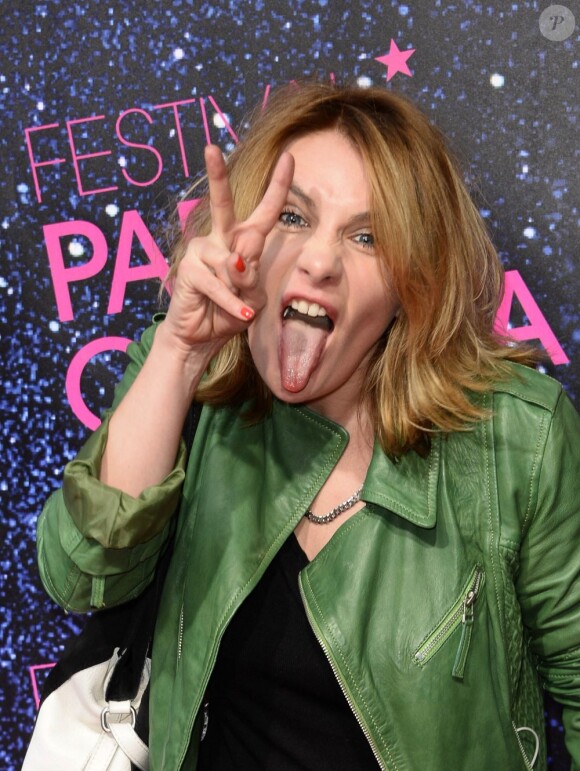 Marie-Amelie Seigner grimace pendant la première du film La Vénus à la fourrure à l'occasion de l'ouverture du festival Paris Cinéma à Paris, le 27 juin 2013.