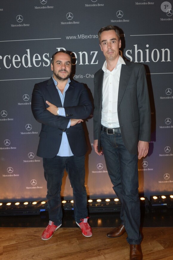 François-Xavier Demaison et Stéphane Boutier (directeur marketing chez Mercedes-Benz) à la soirée haute couture organisée à la Mercedes-Benz Gallery des Champs-Elysées à Paris, le 2 juillet 2013.