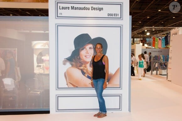 Laure Manaudou, hâlée et épanouie, est fière de présenter sa collection de maillots de bain baptisée 'Laure Manaudou Design' (ou LM Design) à l'occasion du salon Mode City Paris 2013. Le 6 juillet 2013