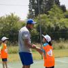 Jo-Wilfried Tsonga, professeur de tennis d'un jour au Village Kinder à Temple-sur-Lot le 8 juillet 2013