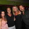 David Ginola et sa femme Coraline, Henri Leconte et sa femme Florentine lors de la soirée au VIP Room de Saint-Tropez qui rassemblait les participants du Classic Tennis Tour, le 12 juillet 2013
