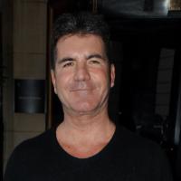 Simon Cowell : Il bronze loin du divorce de la femme enceinte et du mari trompé