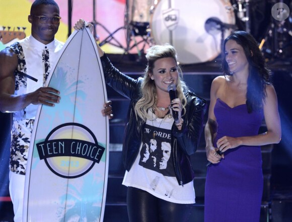 Russell Westbrook, Demi Lovato Lovato et Michelle Rodriguez aux Teen Choice Awards 2013 au Gibson Amphitheatre de Los Angeles, le 11 août 2013.
