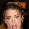 Amber Heard pose au déjeuner de l'Association hollywoodienne de la presse étrangère (HFPA) à Beverly Hills, le 13 août 2013.