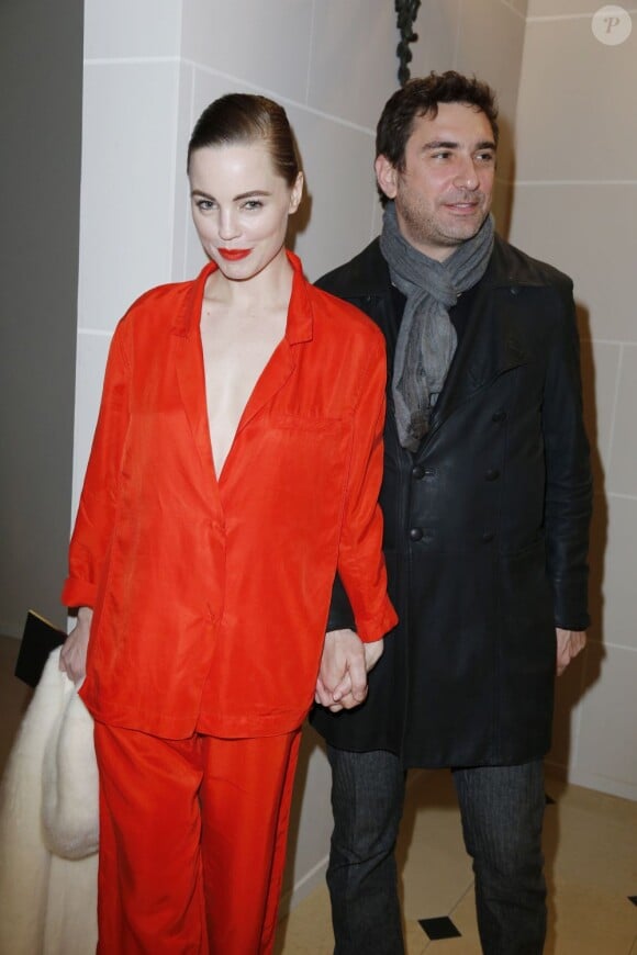 Melissa George et son compagnon Jean-David Blanc au défilé H&M au Musée Rodin, pendant la Fashion Week parisienne, le 27 février 2013. 