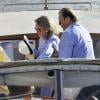 Roger Moore et sa femme Kristina Tholstrup arrivent en bateau à Venise, le 26 août 2013.
