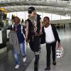 Madonna, accompagnée de David, Mercy et Lourdes à l'aéroport de Londres. Le 3 septembre 2013. La chanteuse s'envole certainement pour New york où elle possède sa résidence principale.