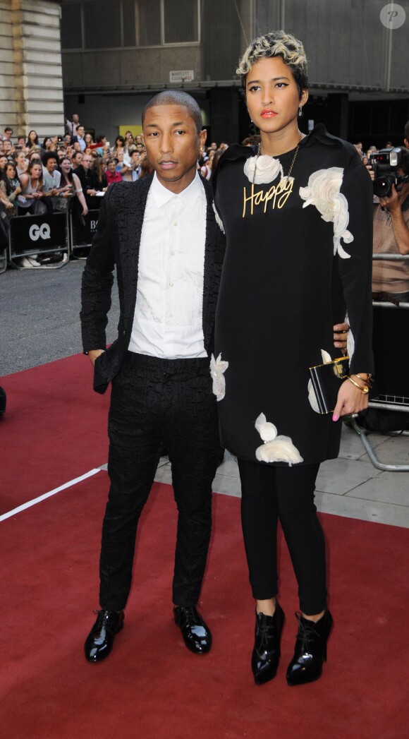 Pharrell Williams et sa compagne sur le tapis rouge des GQ Men of the Year Awards à Londres, le 3 septembre 2013.