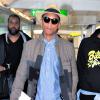Pharrell Williams arrive à l'aéroport Heathrow de Londres pour prendre un avion pour Los Angeles. Le 4 septembre 2013.