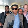 Pharrell Williams arrive à l'aéroport Heathrow de Londres pour prendre un avion pour Los Angeles. Le 4 septembre 2013.