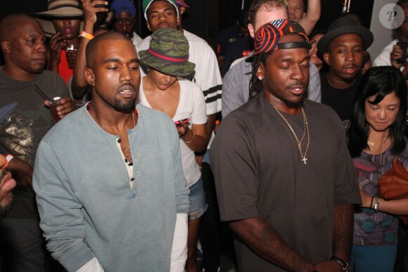 Kanye West et son artiste Pusha T lors de la soirée d'écoute de l'album My Name is My Name à l'Industria Superstudio. New York, le 11 septembre 2013.
