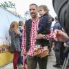 Franck Ribéry avec son fils Seïf el Islam à l'Oktoberfest à Munich le 6 octobre 2013.