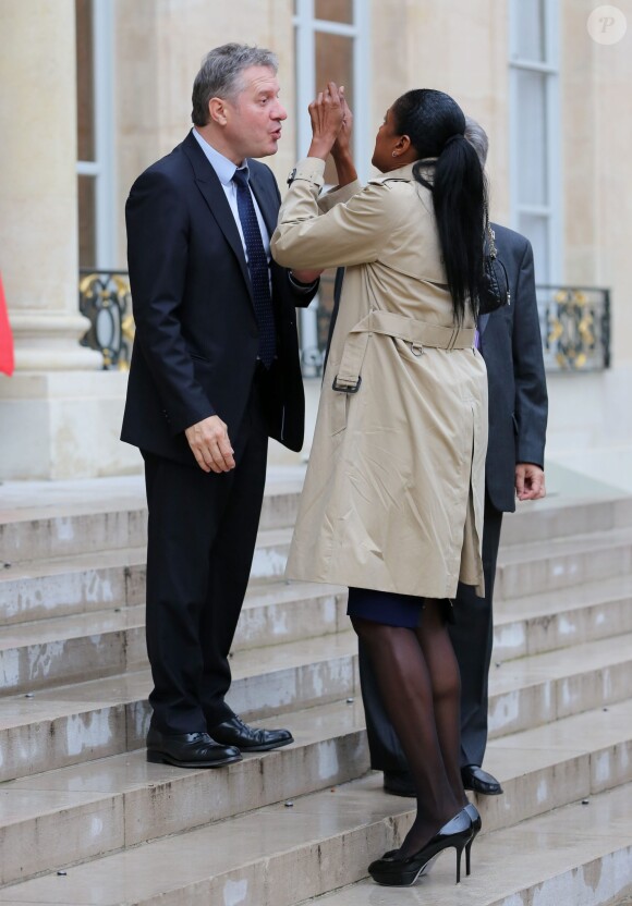 Thierry Rey et Marie-José Pérec lors de la remise des insignes de la Légion d'honneur et de l'Ordre national du Mérite par François Hollande au Palais de l'Elysée le 9 octobre 2013