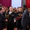 François Hollande et Pape Diouf lors de la remise des insignes de la Légion d'honneur et de l'Ordre national du Mérite par François Hollande au Palais de l'Elysée le 9 octobre 2013