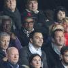 Yannick Noah avec son fils Joalukas, sa femme Isabelle Camus et son père Zacharie lors du match de ligue des champions entre le Paris Saint-Germain et le RSC Anderlecht au Parc des Princes à Paris le 5 novembre 2013