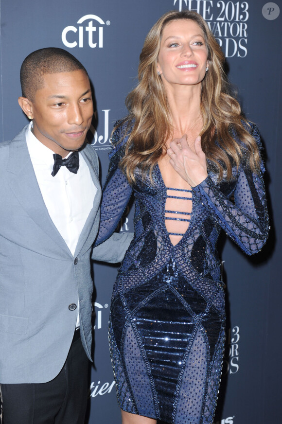Pharrell Williams et Gisele Bündchen assistent aux 2013 Innovator Of The Year Awards organisés par le magazine WSJ au Musée d'art moderne à New York. Le 6 novembre 2013.
