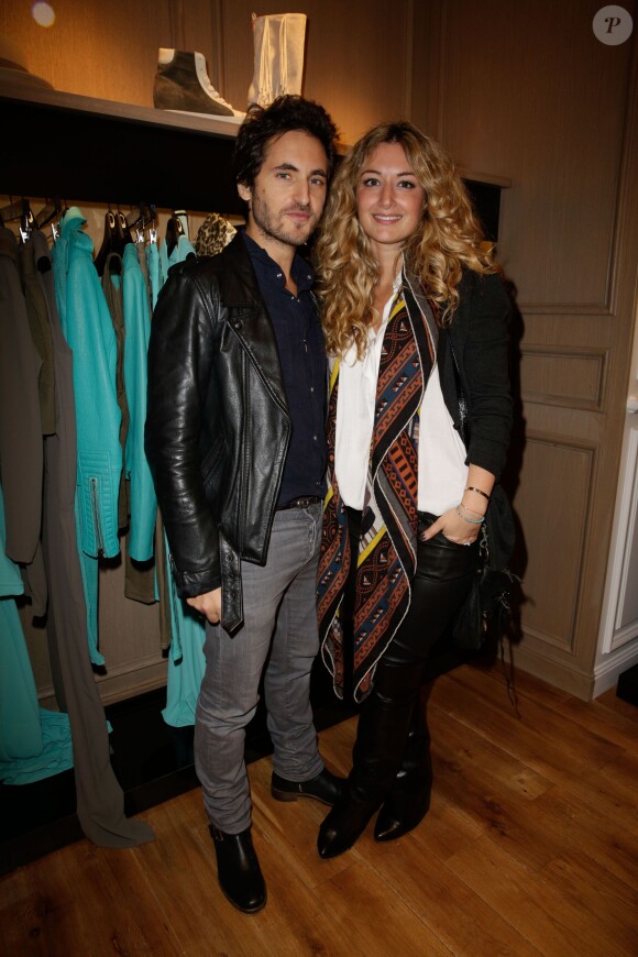 Mickaël Miro et sa compagne à l'inauguration du magasin "Hotel Particulier" à Paris, le 6 novembre 2013.