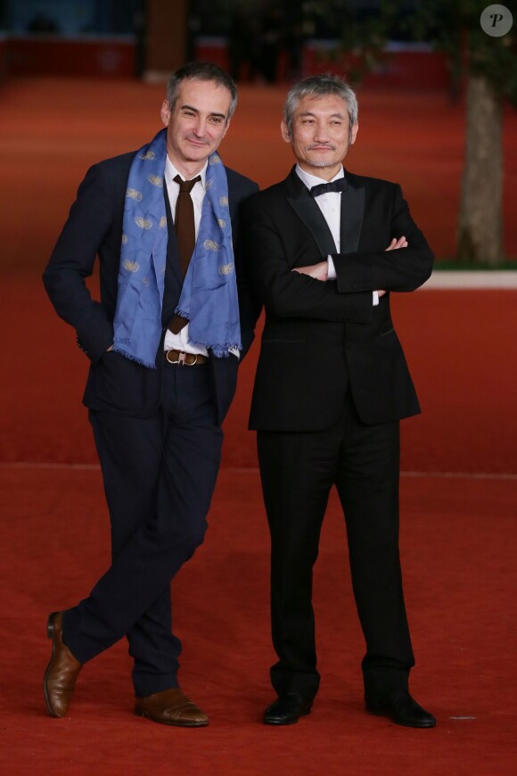 Les réalisateurs Olivier Assayas et Tsui Hark lors de la clôture du Festival international du film de Rome le 16 novembre 2013