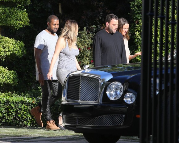 Kanye West, Kim Kardashian et des amis à Miami le 28 novembre 2013. Yeezus y poursuit sa tournée avec un concert à l'American Airlines Arena, ce vendredi 29 novembre.