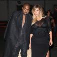 Kanye West et Kim Kardashian lors du défilé Givenchy prêt-à-porter printemps-été 2014 à la Halle Freyssinet. Paris, le 29 septembre 2013.