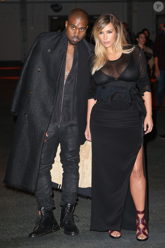 Kanye West et Kim Kardashian lors du défilé Givenchy prêt-à-porter printemps-été 2014 à la Halle Freyssinet. Paris, le 29 septembre 2013.