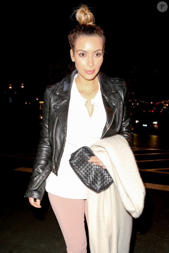 Exclusive - Kim Kardashian enjoys a family night out at the movie theater with Kanye, Kendall, Kris, Kourtney, Scott, Blac Chyna and Tyga, where they watched Anchorman 2 in Calabasas, Los Angeles, CA, USA on December 21, 2013. Kim looked pretty in a white blouse with pink tights, a black leather jacket and heels. Meanwhile Kendall wasn't in the mood for pictures as she hid her face under the hood of her sweater. Kylie and Khloe missed out on the family outing. Photo by GSI/ABACAPRESS.COM22/12/2013 - Los Angeles