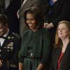 Michelle Obama au côté du soldat Cory Remsburg, lors du discours annuel de Barack Obama sur l'état de l'Union, devant les membres du Congrès, ainsi que le vice-président Joe Biden, à Washington, le 28 janvier 2014.