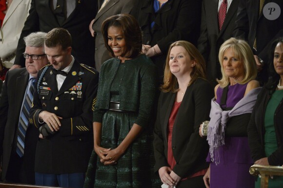 Michelle Obama au côté du soldat Cory Remsburg, lors du discours annuel de Barack Obama sur l'état de l'Union, devant les membres du Congrès, ainsi que le vice-président Joe Biden, à Washington, le 28 janvier 2014.