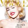 Miley Cyrus se le joue madone au seins nus en couverture du magazine Vogue Allemand, en février 2014.