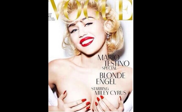 Miley Cyrus se le joue madone au seins nus en couverture du magazine Vogue Allemand, en février 2014.
