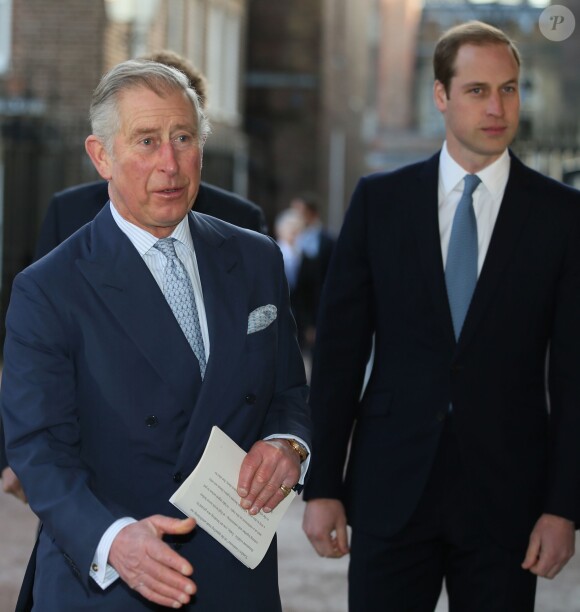 Le prince Charles et ses enfants, le prince William et le prince Harry à la conférence sur le commerce illicite de la faune à Lancaster House, à Londres, le 13 février 2014.
