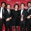 Guillaume Gallienne pose avec ces César et ses producteurs après la 39e cérémonie des César du Cinéma à Paris, le 28 février 2014.