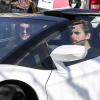 Kendall Jenner, en Lamborghini avec Scott Disick, compagnon de sa demi-soeur Kourtney, au complexe commercial The Commons. Calabasas, Los Angeles, le 16 mars 2014.