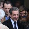 Arrivés à la gare de l'Est d'un train en provenance de Strasbourg, où Carla Bruni se produisait la veille, Nicolas Sarkozy et sa femme se sont rendus directement au bureau de vote du 16e arrondissement à Paris, le 23 mars 2014.