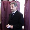 Nicolas Sarkozy vote dans le 16ème arrondissement de Paris à l'occasion des élections municipales, le 23 mars 2014.