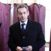 Carla Bruni-Sarkozy et Nicolas Sarkozy votent dans le 16ème arrondissement de Paris à l'occasion des élections municipales, le 23 mars 2014.