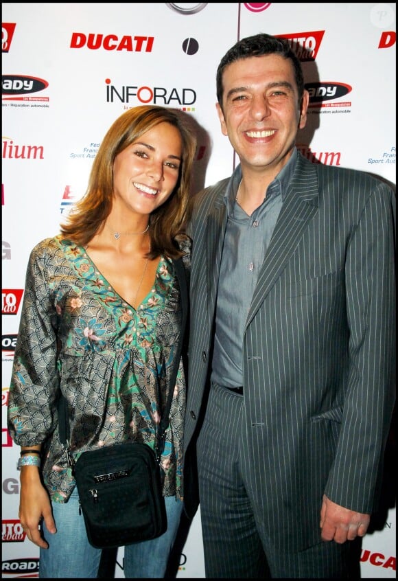 Thierry Gilardi et Melissa Theuriau lors de la 1er nuit des Sports de TF1 à l'Etoile, le 21 mars 2006 à Paris