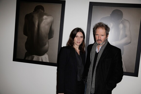 Géraldine Pailhas et son compagnon Christopher Thompson au vernissage de l'exposition Robert Mapplethorpe au Grand Palais, organisé par la société Aurel BGC, mécène exclusif de cette rétrospective. À Paris, le 24 mars 2014.