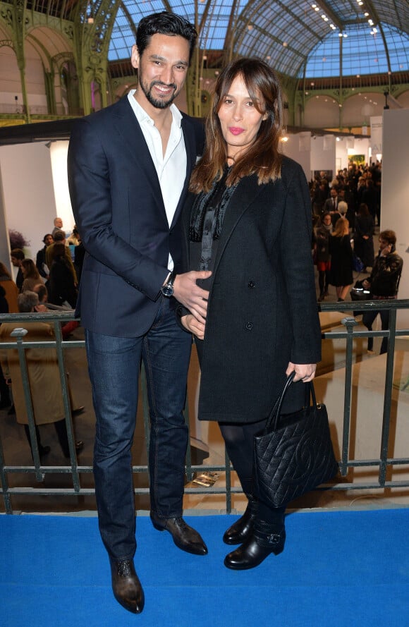 Dolores Chaplin (enceinte) et son compagnon Stany Coppet à l'inauguration de l'exposition "Art Paris Art Fair" au Grand Palais à Paris, le 26 mars 2014.