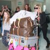 Kate Moss et sa fille Lila arrivent à Sao Paulo le 4 avril 2014, pour assister au gala de l'amfAR.