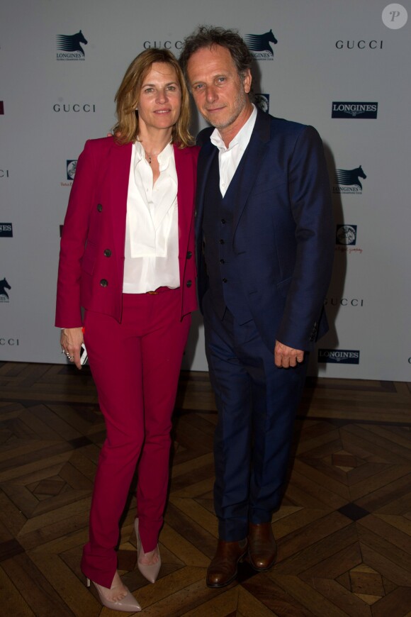 Virginie Coupérie-Eiffel pouvait compter sur le soutien de son compagnon Charles Berling lors de la présentation de la 1re édition du Paris Eiffel Jumping, le 8 avril 2014 à l'Hôtel de Ville de Paris.