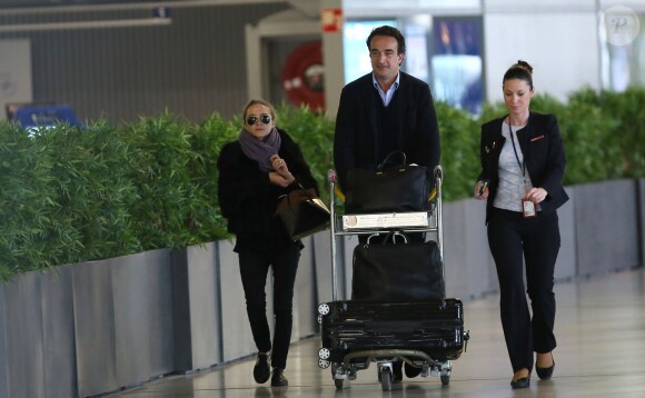 Exclusif - Mary-Kate Olsen et Olivier Sarkozy à l'aéroport Roissy-Charles-de-Gaulle pour se rendre à New York après leur séjour à Paris, le 6 avril 2014.