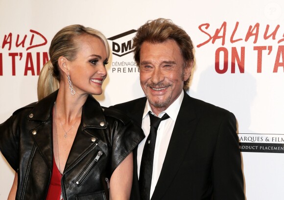 Johnny Hallyday et sa femme Laeticia - Avant-première de "Salaud, on t'aime" sur les Champs-Elysées à Paris le 31 mars 2014.