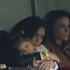 Emilie Nef Naf avec sa fille Maëlla assistent au match de football PSG contre Reims au Parc des Princes à Paris le 5 avril 2014.